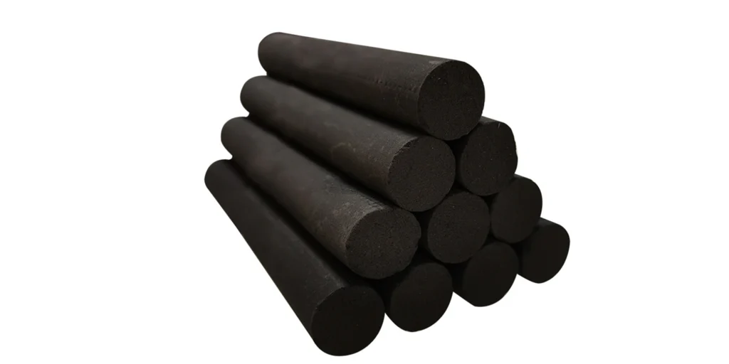 a stack of black cylindrical objects, arranged in a pyramid-like structure. The cylinders are uniform in size and appear to be made from a material with a matte finish, possibly rubber or plastic. They are placed closely together, creating a solid-looking pile that suggests they might serve an industrial purpose, such as insulation or sealing components.