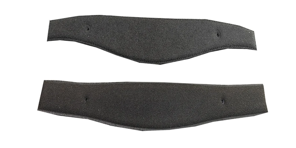 two identical black, curved fabric straps placed on a plain white background. Each strap features a soft, textured surface and has two small holes, suggesting they could be used for attaching to other items, perhaps as part of sports gear, protective equipment, or custom accessories. Their flexible, contoured shape hints at a design meant for comfort and secure fitting.