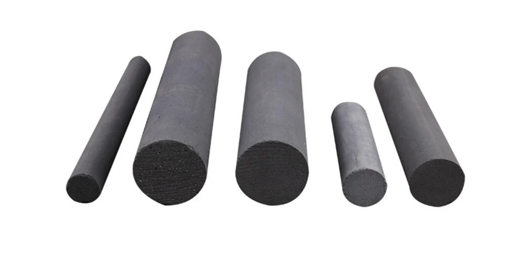 five cylindrical objects, likely made of rubber or a similar material. They are black in color and vary slightly in size from left to right. The first object on the far left is the smallest, while the second one is larger than the first but smaller than the third. The fourth object is the smallest among them, and the fifth object is almost as large as the third. Each cylinder has a smooth surface with no visible markings or patterns.