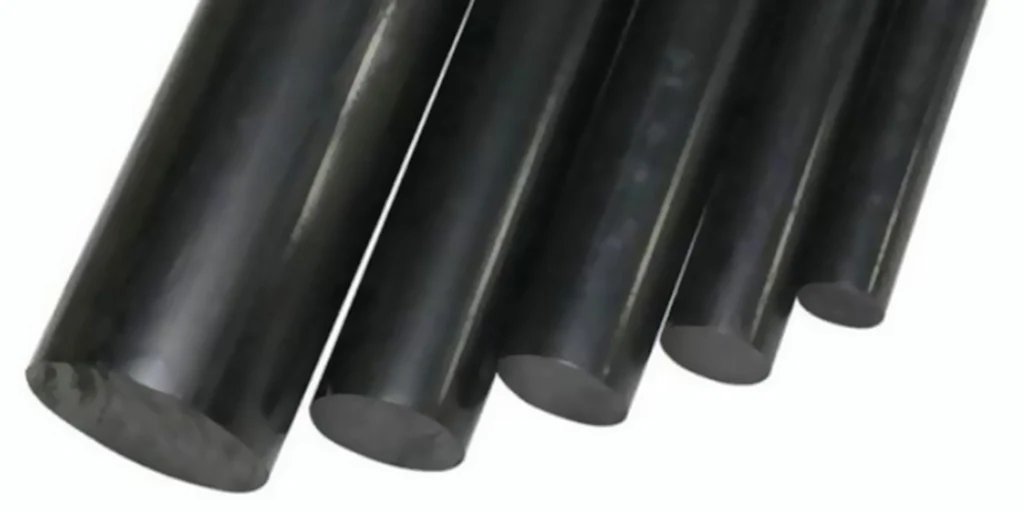 a set of black cylindrical objects, likely metal rods or bars. They are arranged in descending order from left to right, with the largest rod on the far left and the smallest one on the far right. The surfaces of these objects appear smooth and shiny, suggesting they may be made of steel or another type of durable material. There is no background detail; the focus is solely on the arrangement and appearance of the rods themselves.