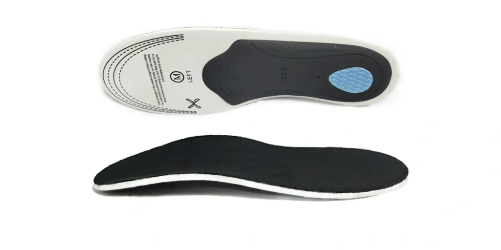 an orthopedic insole from two perspectives. The top view features a white base with gray and blue support zones, marked “LEFT” and containing sizing/usage text. The bottom view displays a black fabric surface, likely for comfort and breathability. Designed to provide foot support, it targets arch and heel areas, aiding in alignment and pain relief for improved foot health.