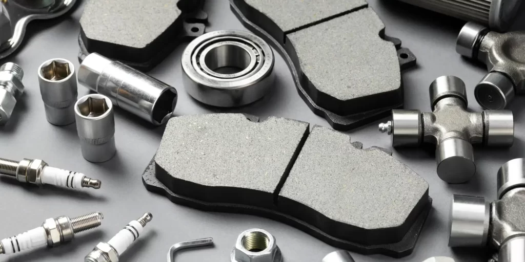 A wide range of mechanical parts are displayed. We can see various types of bolts, nuts, washers, bearings and gears. These parts may be used in the repair or manufacture of automobiles or other mechanical equipment.