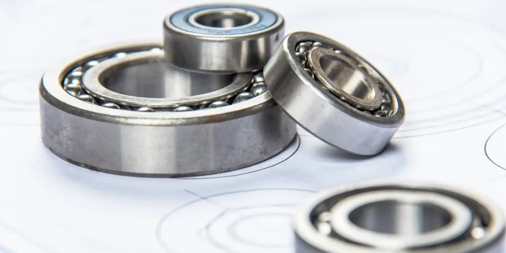 The picture shows a number of bearings, both round and square, in a silver color that looks more precise.