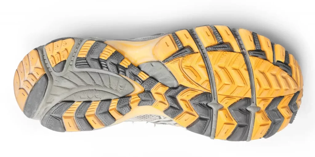 A yellow sneaker sole, shot from directly above.