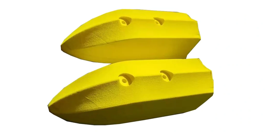 AlternativeText: “Two yellow foam objects with two holes each, set against a white background.” Caption: “Yellow foam pieces with dual holes, stacked for display.” Description: “This image features two yellow foam objects, likely designed for aquatic use. Each object has a textured surface and two curved holes, which might serve for gripping or attachment. Positioned one above the other on a plain white background, their bright color and distinct shape are highlighted, emphasizing their functional design.”