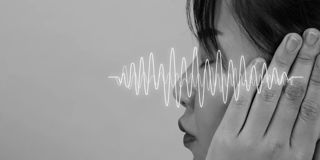 a person covering their ears with an overlaid white line graph depicting a sound wave. This conceptual image likely symbolizes the reduction of noise or the concept of soundproofing. Given the title, "EVA Foam Transforming Industries with Sound and Vibration Dampening Solutions," it suggests that EVA (Ethylene-Vinyl Acetate) foam is being highlighted for its properties in dampening sound and vibrations, which is a valuable feature in various industrial applications. Such foam can be used in the automotive industry, construction, and manufacturing to minimize noise pollution and absorb vibrations, contributing to a quieter and more comfortable environment.