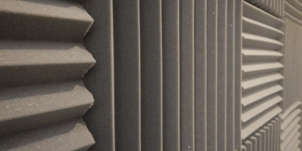 The picture shows a gray sound-absorbing material with a rough, uneven surface and many small pores. This material is widely used in recording studios, theaters, and other venues to absorb sound and reduce echoes, improving the hearing experience.