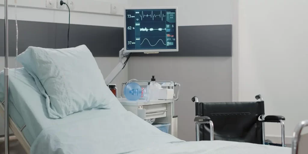 a hospital room, featuring a hospital bed and a monitor displaying vital signs, which suggests a focus on patient care and monitoring. The mention of EVA foam in the context of hospital bed accessories implies that the material is being used to enhance patient comfort. EVA (ethylene-vinyl acetate) foam is known for its cushioning properties, being both soft and resilient. It's commonly used in medical settings for various purposes, including padding for hospital beds, wheelchairs, and other supportive accessories. EVA foam can help in preventing pressure sores and providing comfort to patients who need to stay in bed for extended periods. The durability and ease of cleaning EVA foam make it particularly suitable for hospital environments where hygiene is paramount, and the material needs to withstand frequent cleaning and disinfection.