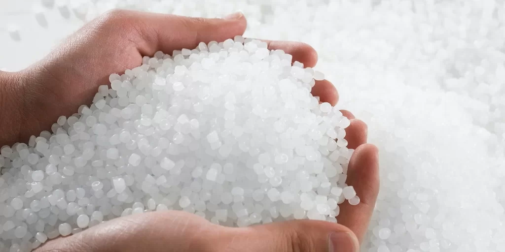 White crystal grains with a uniform and fine texture, presenting a soft glow and a sense of luster. It radiates a unique light that gives off a sense of mystery and beauty.